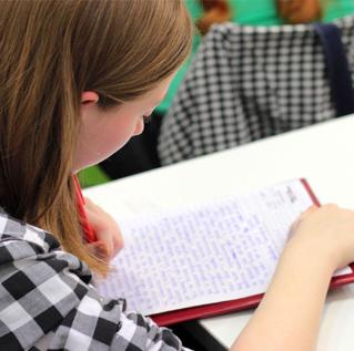 girl reading paper